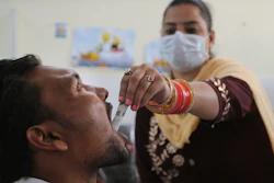 In this Oct. 31, 2019, photo, a medic administers medicine to a recovering drug addict at a de-addiction center in Kapurthala, Punjab, India.