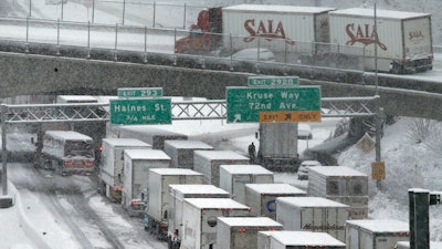 In this Jan. 11, 2017, file photo, early morning traffic at a standstill on Interstate 5 in Portland, Ore.