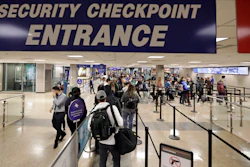 In this Nov. 27, 2019, file photo, travelers walk through a security checkpoint in Terminal 2 at Salt Lake City International Airport.
