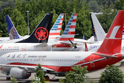 In this June 27, 2019, file photo, dozens of grounded 737 Max airplanes crowd a parking area adjacent to Boeing Field in Seattle.