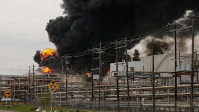 In this March 18, 2019, file photo, firefighters battle a fire at the Intercontinental Terminals Company in Deer Park, Texas.