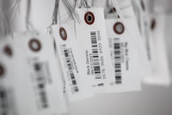 In this Sept. 24, 2015, file photo, tags with bar codes hang at a facility in Flandreau, S.D.