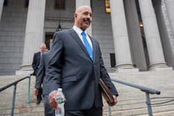 In this Oct. 22, 2019, file photo, Ted Wells, Jr., the lead attorney for Exxon, leaves New York Supreme Court in New York.