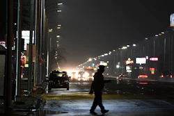 In this May 2, 2019, file photo, a pedestrian crosses Gratiot Street at Outer Drive East in Detroit.
