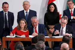 Deputy Prime Minister of Canada Chrystia Freeland, left, Mexico's top trade negotiator Jesus Seade, center, and U.S. Trade Representative Robert Lighthizer sign an update to the North American Free Trade Agreement at the national palace in Mexico City, Dec. 10. 2019.