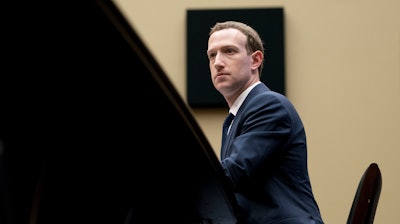 In this April 11, 2018, photo, Facebook CEO Mark Zuckerberg listens to a question as he testifies before a House Energy and Commerce hearing on Capitol Hill.