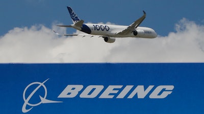 In this June 17, 2019, file photo, an Airbus A 350-1000 performs a demonstration flight at the Paris Air Show.