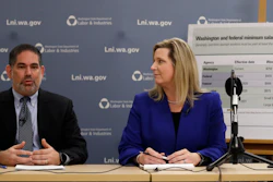 Washington state Labor and Industries Director Joel Sacks, left, and Deputy Director Elizabeth Smith talk about new overtime rules during a news conference, Dec. 11, 2019, in Tukwila, Wash.