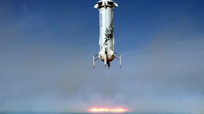 In this image provided by Blue Origin, the New Shepard rocket booster lands near Van Horn, Texas.