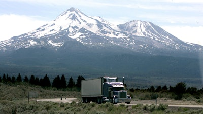 In this June 19, 2008, file photo, a truck drives past Mt. Shasta, near Weed, Calif.