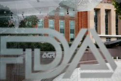 This Aug. 2, 2018, file photo shows the U.S. Food and Drug Administration building behind FDA logos at a bus stop on the agency's campus in Silver Spring, Md.
