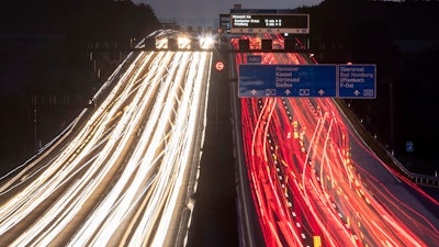 In this Sept. 19, 2019, exposure photo, cars drive on a highway in Frankfurt, Germany.