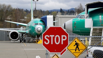 In this April 8, 2019, file photo, Boeing 737 Max 8 jets at a Boeing Co. production facility in Renton, Wash.