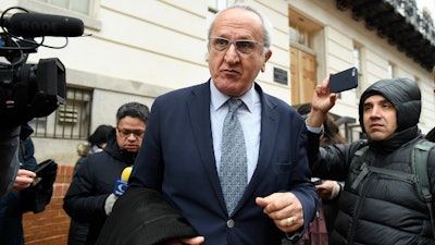 Jesus Seade, Mexican undersecretary to North America, is followed by journalists as he leaves following a meeting with U.S. Trade Representative Robert Lighthizer​​ in Washington, Dec. 16, 2019.