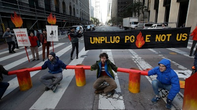 Protesters block traffic on Beale Street at a Pacific Gas & Electric building, San Francisco, Dec. 16, 2019.