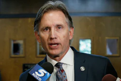 In this Oct. 15, 2019, file photo, Oklahoma Attorney General Mike Hunter talks with reporters following a hearing to settle disagreements between Johnson & Johnson and the state.