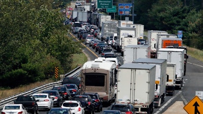 In this Aug. 12, 2016, file photo, traffic crawls eastbound on Interstate 84 in Sturbridge, Mass.