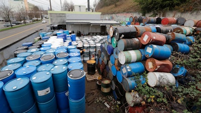 Dozens of barrels fill an outside storage area at Seattle Barrel and Cooperage, Dec. 18, 2019, in Seattle.