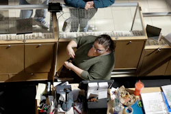 In this April 9, 2018, file photo, a cashier rings up a purchase at a store in Salem, N.H.