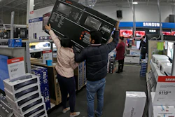 In this Nov. 28, 2019, file photo, people shop at a Best Buy store during a Black Friday sale in Overland Park, Kan.