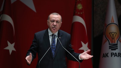 Turkish President Recep Tayyip Erdogan addresses the members of his ruling party, in Ankara, Dec. 26, 2019.