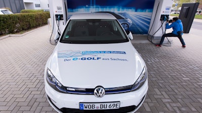 e-Golf car at a charging station during a press tour of the Volkswagen plant in Zwickau, May 14, 2019.