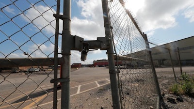 Locked gates are seen outside the closed Bayou Steel Group steel mill in LaPlace, La., Oct. 1, 2019.