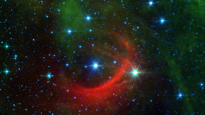 Runaway star Kappa Cassiopeiae, or HD 2905, and its bow shock captured by the Spitzer Space Telescope.