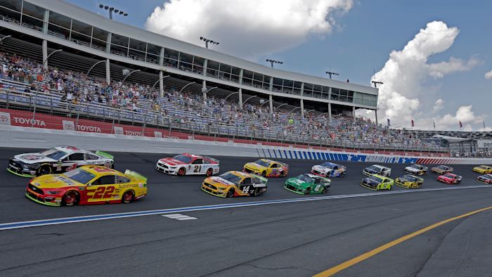 In this Sept. 29, 2019, file photo, cars drive through Turn 4 to start the NASCAR Cup Series auto race at Charlotte Motor Speedway in Concord, N.C.