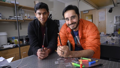 Georgia Tech undergraduate Gaurav Byagathvalli and assistant professor Saad Bhamla with examples of butane lighters they used to create the ElectroPen.