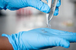 A sample of ultra-thin, ultra-flexible electronic material that could be printed and rolled out like newspaper.