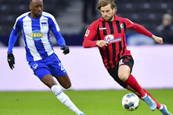 Hertha's Dodi Lukebakio, left, and Freiburg's Lucas Hoeler, right, during a match between Hertha BSC Berlin and SC Freiburg in Berlin, Dec. 14, 2019.