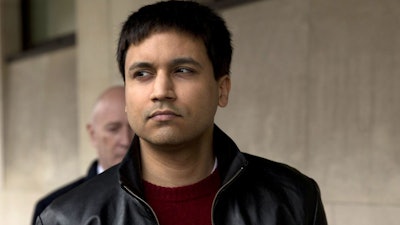 In this March 23, 2016, file photo, British futures trader Navinder Singh Sarao leaves after the ruling in his extradition hearing at Westminster Magistrates Court in London.