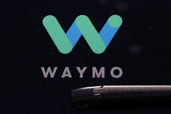 Waymo logo on the window of a car at the Google I/O conference in Mountain View, Calif., May 8, 2018.