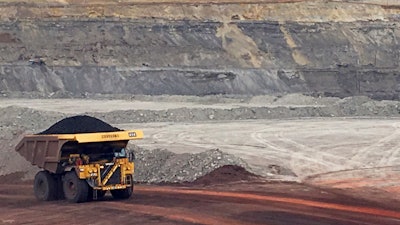 In this March 28, 2017, file photo, a dump truck hauls coal at Contura Energy's Eagle Butte Mine near Gillette, Wyo.