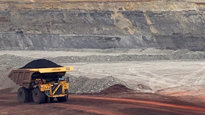 In this March 28, 2017, file photo, a dump truck hauls coal at Contura Energy's Eagle Butte Mine near Gillette, Wyo.