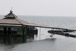 A man fishes near an abandoned mosque in Jakarta, July 27, 2019.