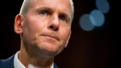 In this Oct. 29, 2019, file photo, Boeing President and CEO Dennis Muilenburg testifies on Capitol Hill.