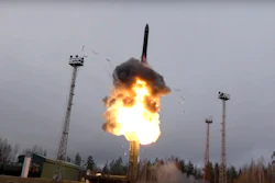 In this photo, taken from undated footage distributed by Russian Defense Ministry Press Service, an intercontinental ballistic missile lifts off from a truck-mounted launcher.