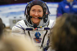 In this March 14, 2019, file photo, U.S. astronaut Christina Koch speaks with her relatives prior the launch of a Soyuz MS-12 space ship at the Baikonur cosmodrome, Kazakhstan.