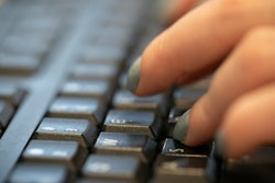 In this Oct. 8, 2019, file photo, a woman types on a keyboard in New York.