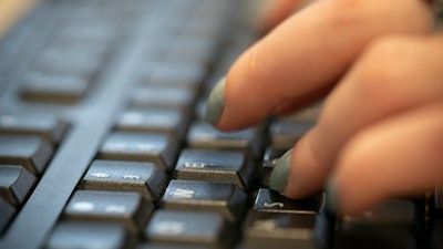 In this Oct. 8, 2019, file photo, a woman types on a keyboard in New York.