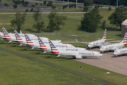 In this May 24, 2019, file photo, grounded Boeing 737 Max jets belonging to American Airlines are stored at Tulsa International Airport in Tulsa, Okla.