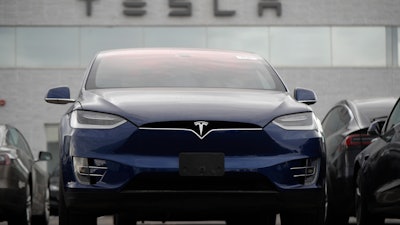 In this Oct. 20, 2019, photo, an unsold 2019 Model X at a Tesla dealership in Littleton, Colo.