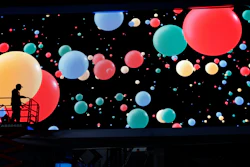 A worker helps set up the Google booth before CES International, Jan. 4, 2020, in Las Vegas.