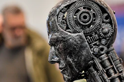 In this Nov. 29, 2019, file photo, a metal head made of motor parts, symbolizing artificial intelligence, at the Essen Motor Show, Germany.