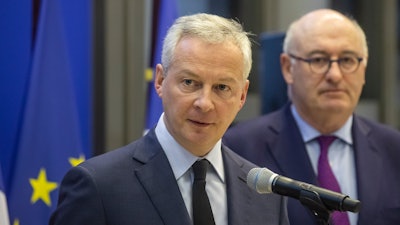 French Finance Minister Bruno Le Maire, left, and European Trade Commissioner Phil Hogan attend a media conference after their meeting in Paris, Jan. 7, 2020.
