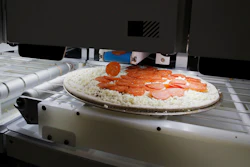Picnic's pizza-making robot makes a pizza during the CES tech show, Jan. 8, 2020, in Las Vegas.