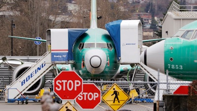 In this Dec. 16, 2019, file photo, Boeing 737 Max jets sit parked in Renton, Wash.
