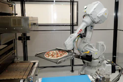 In this Aug. 29, 2016, file photo, a robot places a pizza into an oven at Zume Pizza in Mountain View, Calif.